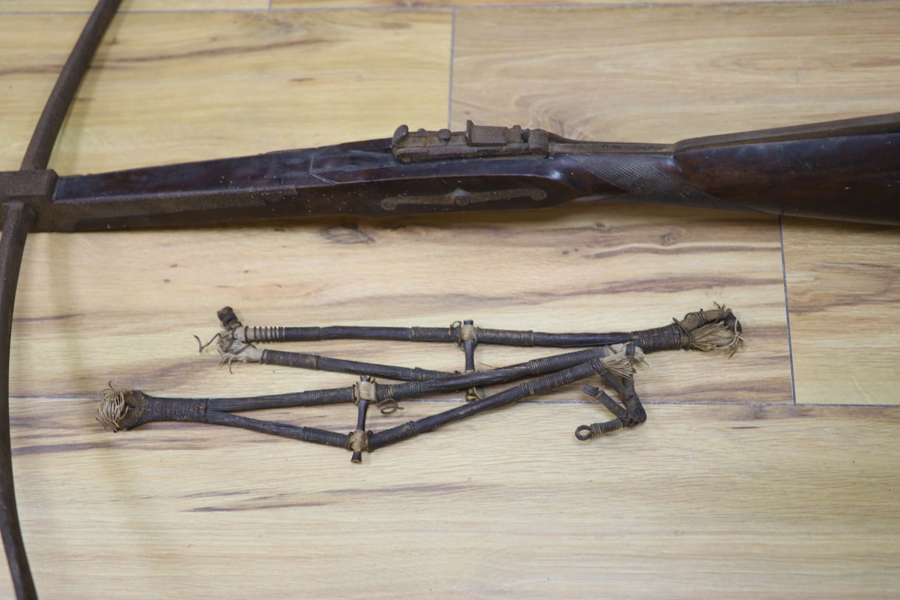 A 19th century steel and walnut crossbow